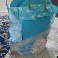 گهواره پسرانه کنار تخت مادر