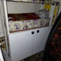 میز اتو و سبد سیب زمینی پیاز