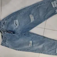 شلوار لی زخمی