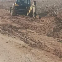 گود برداری و تسطیح زمین و حفر کانال با بیل بکهو