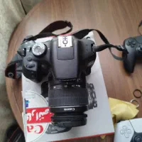 دوربین عکاسی کنون ۲۰۰۰D لنز وباتری و شارژر فابریک