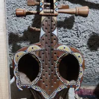 چنگ یا قیچک یا سروز|سازهای سنتی|بندرعباس, |دیوار