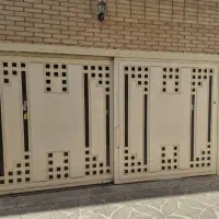 فروش درب اهنی ریلی پارکینگ دو لنگه سالم و تمیز