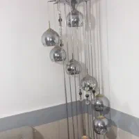 اباژر ایستاده کنارسالنی  ۹ چراقی