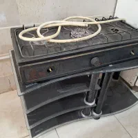 گاز و یک عدد میز تلویزیون