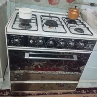 اجاق گاز و استند۵طبقه وسبدسیب و پیاز