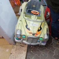 ماشین تکان دهنده واسه بازی بچه هاجلو مغازه