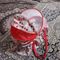 گهواره و پشه بند نوزاد