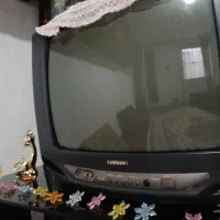 تلوزیون سامسونگ  میز تلوزیون شیشه ایی مشکی وبوفه