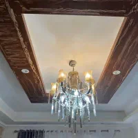 لوستر شیک ۱۰ شعله به همراه لاله ‌و کریستال