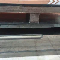 زیر تلویزیون بوفه و ساعت فروشی