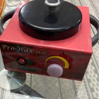 دستگاه موم گرم کن (وکس ) و موم عدسی