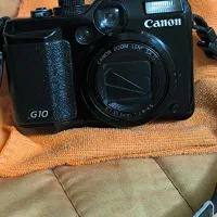 دوربین عکاسی کانن و الیمپوس