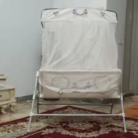 گهواره همراه با پشه بند