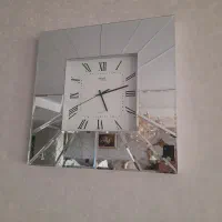 ساعت دیواری اینه ای.