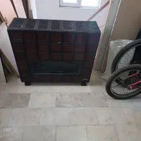 بخاری و اجاق گاز و فرش