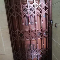 حفاظ آکاردیونی با رنگ کوره و حفاظ پنجره