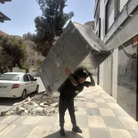 کارگر باربر حمل اثاث خونه یخچال گاو صندوق