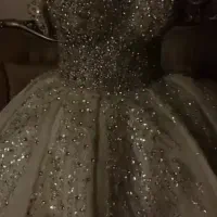 لباس عروس دنباله دار ده فنره سنگدوزی با دست.