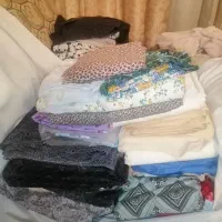 تعدادی قواره پارچه،چادر،لباس، کت وشلوار،ملحفه نو