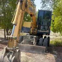 خدمات مینی بیل میکانیکی چرخ لاستیکی|خدمات پیشه و مهارت|رودان, |دیوار