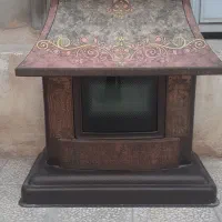 بخاری و میز تلویزیون