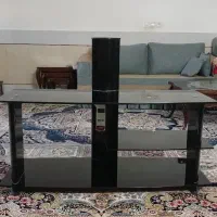 میز تلویزیون شیشه‌ای مشکی شیک و تمیز