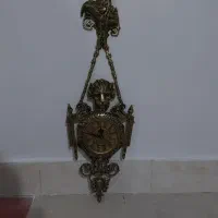 ساعت و شمعدان برنز