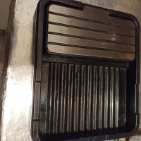کنار اجاق گاز جای قاشق و در قابلمه