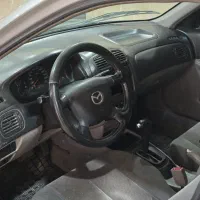 مزدا 323 اتوماتیک FL|خودرو سواری و وانت|پرند, فاز ۰|دیوار