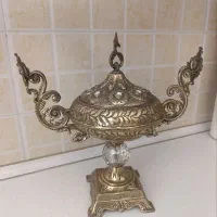 گارگر پرداخت کار لوستر و اجناس برنجی