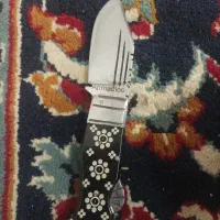 چاقو و تسبیح نقرکوب