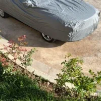 چادر ماشین ۲تااون یکی ام برزنتیه سفید وآبی راه راه