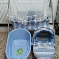 یک عدد نی نی لای لای و گهواره و وان شستشوی نوزاد