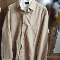 فروش تعدادی شلوار پیراهن بعلت جمع کردن مغازه