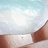 یه پلاستیک سفید حاوی پرونده تحصیلی و سند موتور