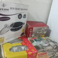 تعدادی ظرف|ظروف پختوپز|خرمآباد, |دیوار