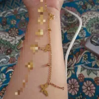 دستبند ژوپینگ طلا رنگ ثابت مدل پروانه ای ۱۰۰ هزار