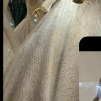 یک عدد لباس عروس تن نرفته نو و دو عدد تن خورده