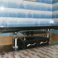 میز زیر تلویزیون شیشه ای کشو دار