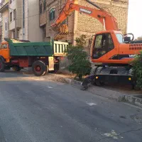 بیل میکانیکی لاستیکی کمپرسی تخریب و خاکبرداری