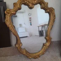 اینه با رنگ طلایی جنس پلی استر