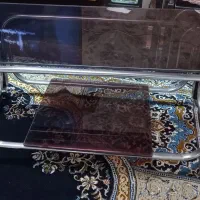 میز شیشه ای جلو مبلی چرخدار