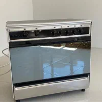 اجاق گاز فر دار ،تمام استیل ۵ شعله.  و هود کن