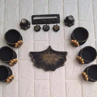 دکوری،هفت سین،ظروف سنگ مصنوعی و شمع اقتصادی