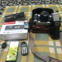 دوربین عکاسی و ضبط|دوربین عکاسی و فیلمبرداری|کنار تخته و کمار, |دیوار