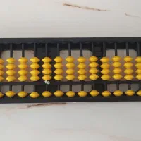 چرتکه همراه کتابش