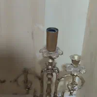 دو عدد جاشمعی برنز هر کدام دارای سه جای شمع