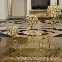 شمعدان طلایی رو میزی مدل کالسکه نگین بافت