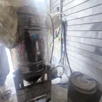 دو دستگاه آبغوره گیری و آب گوجه گیری